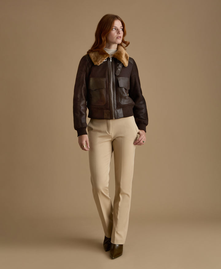 Women's Mabel genuine leather shearling jacket styled with tailored cream trousers