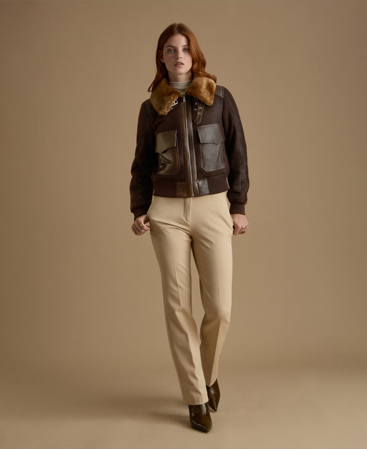 Women's Mabel genuine leather shearling jacket styled with tailored cream trousers