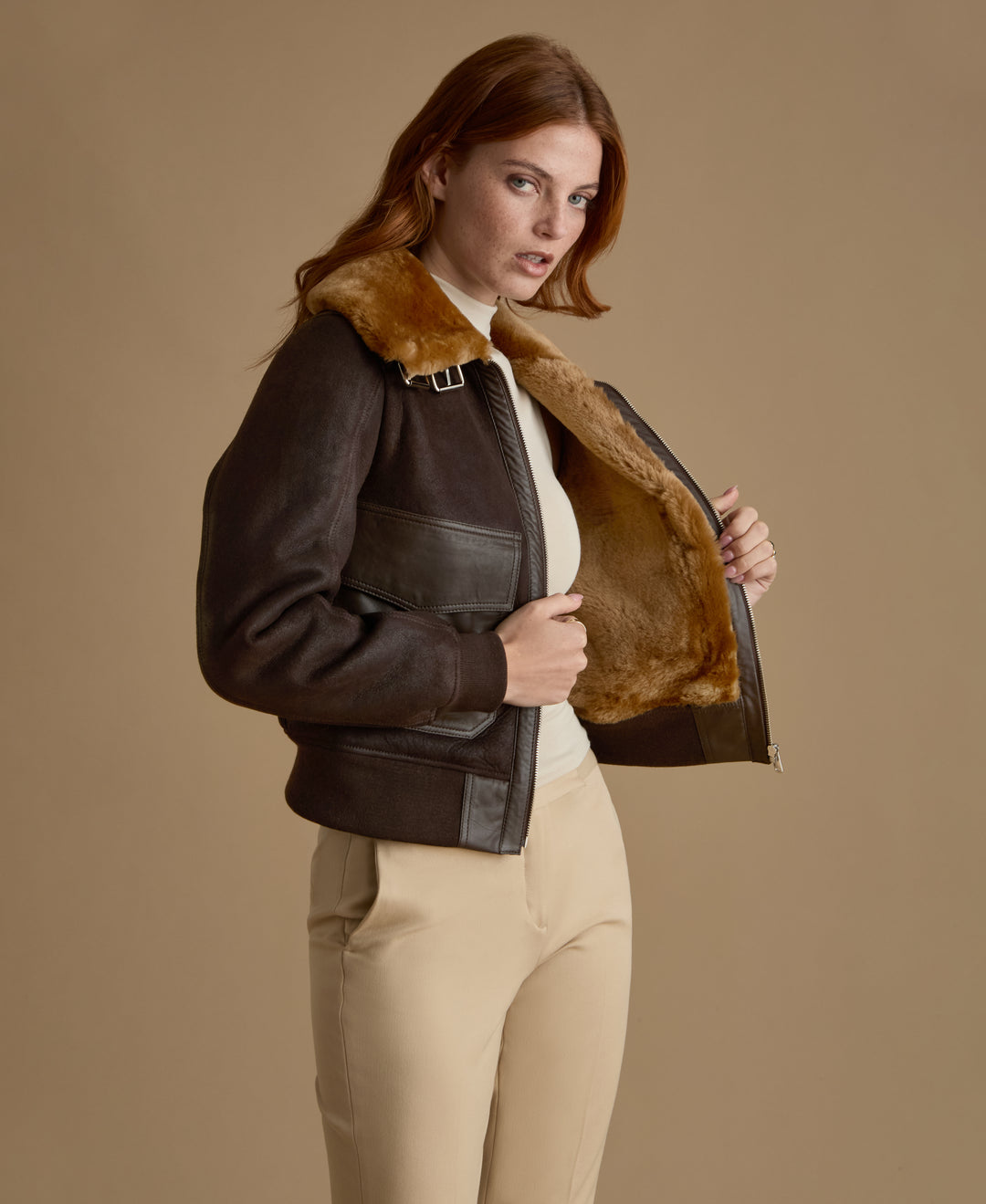 Luxury women's dark brown leather shearling jacket handcrafted for the FURNIQ FW26 collection