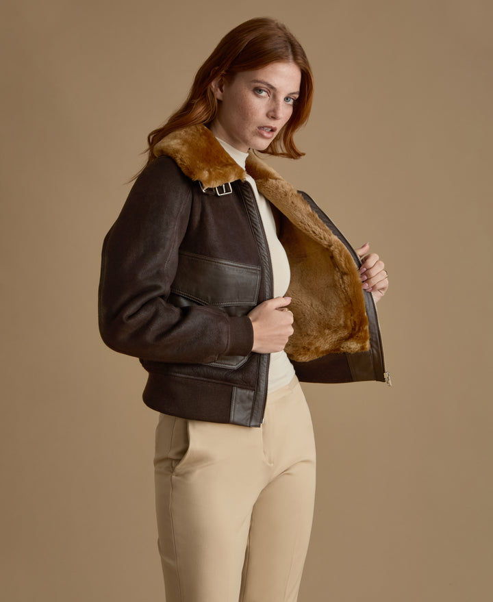 Luxury women's dark brown leather shearling jacket handcrafted for the FURNIQ FW26 collection