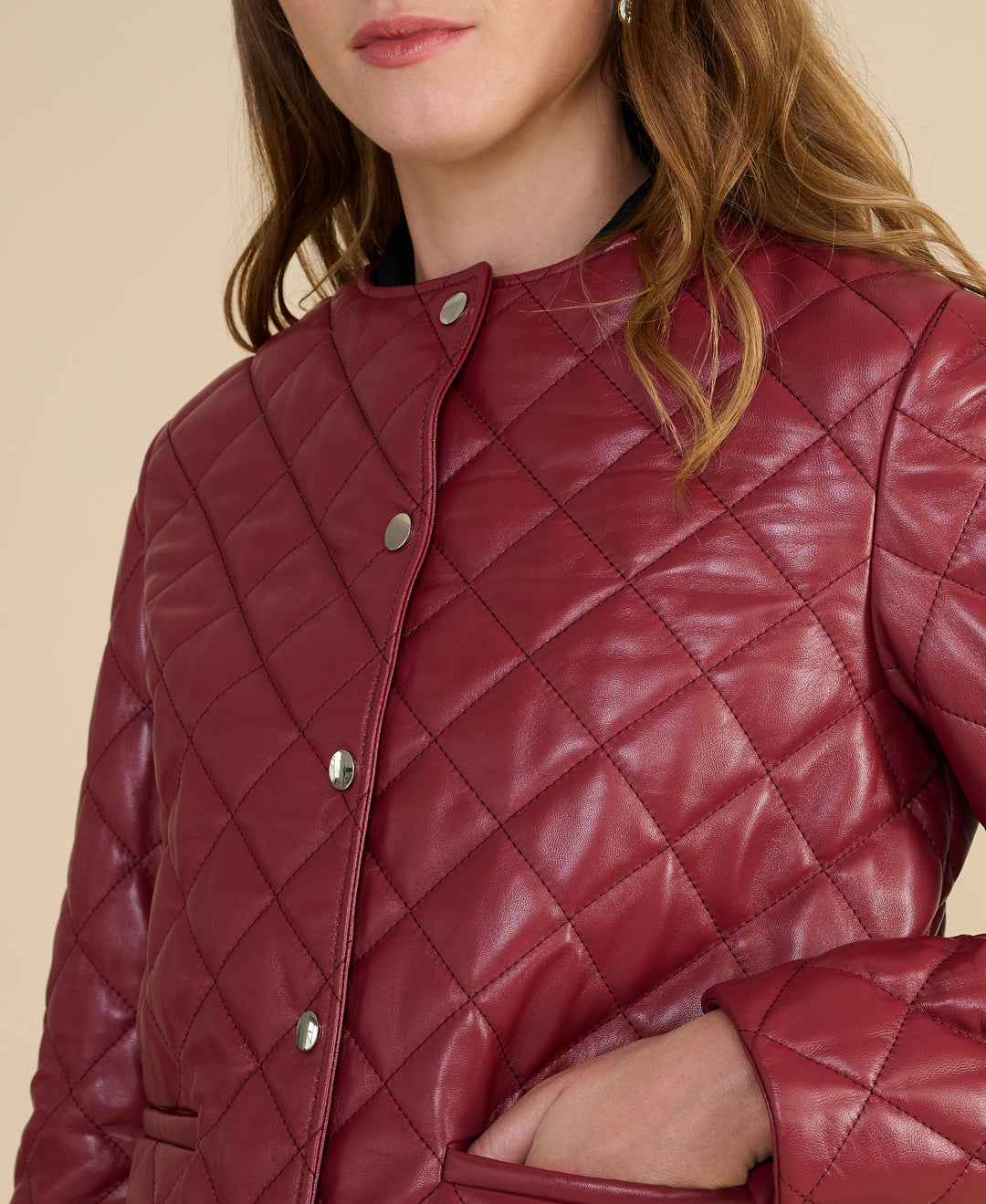 Marlowe light burgundy quilted leather jacket close up showing quilted leather craftsmanship