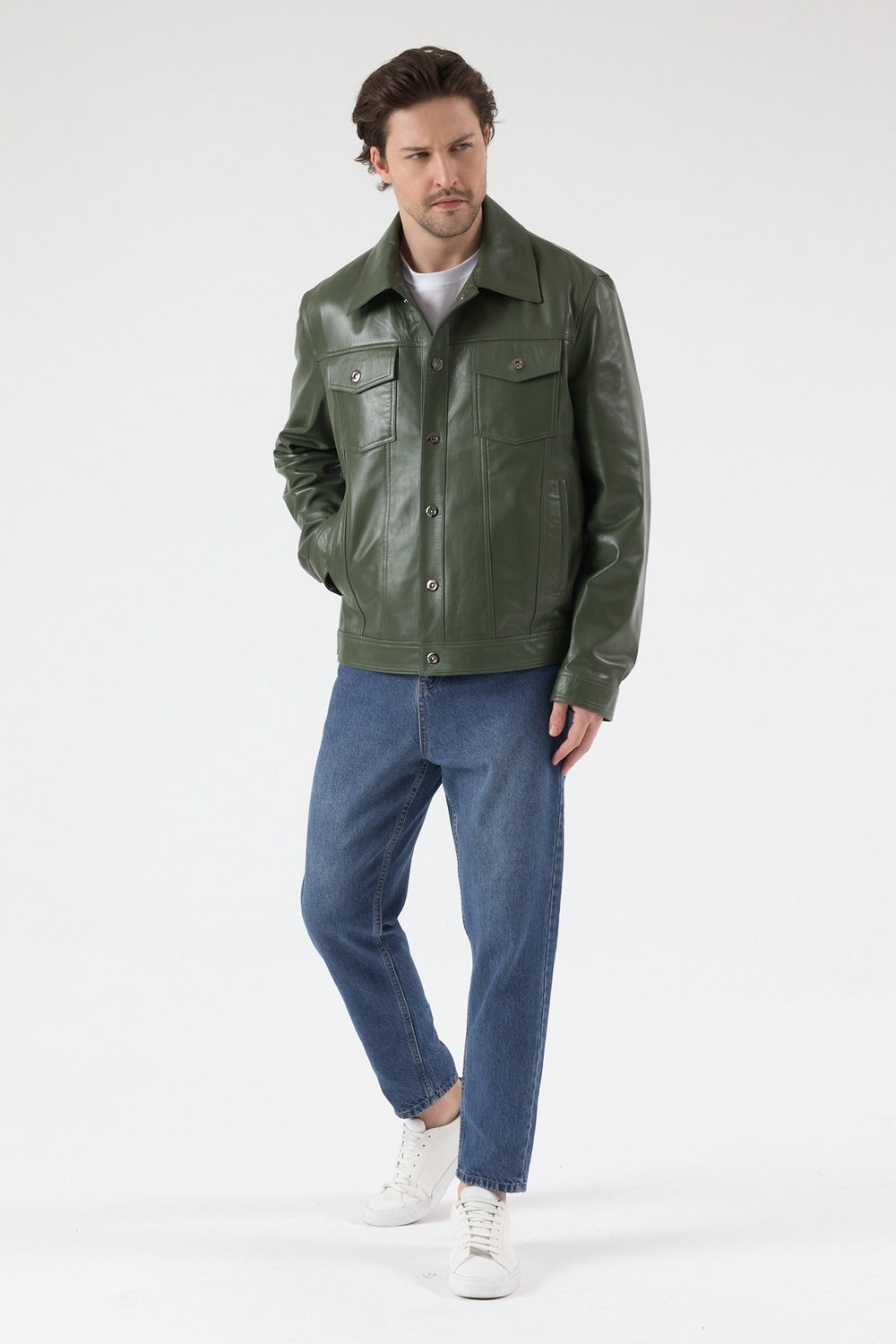 Male model wearing Oliver men's khaki nappa leather jacket with relaxed blue denim jeans