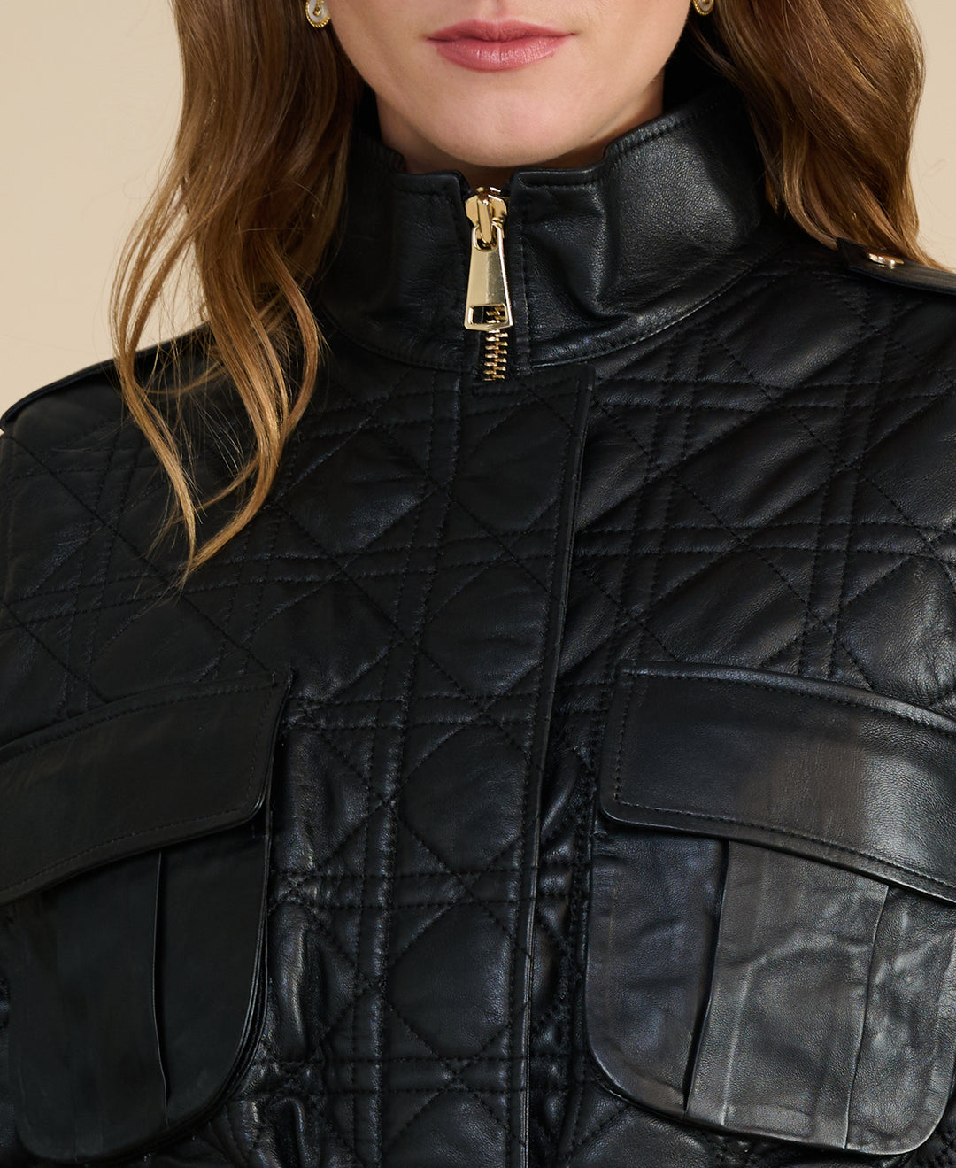 Close-up of the Reese black quilted leather field jacket showing diamond quilting and premium leather