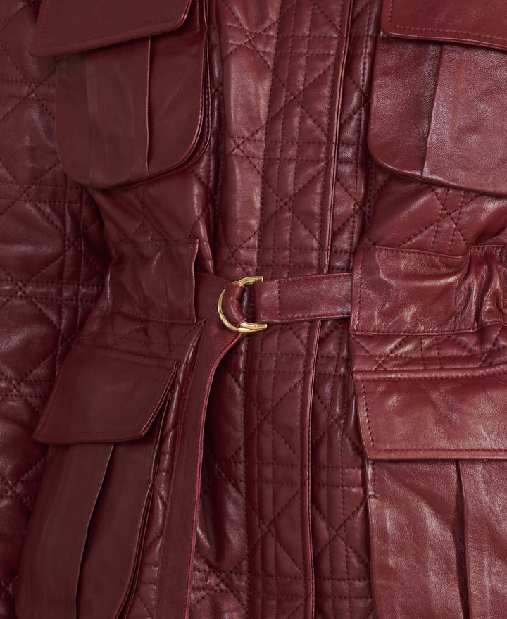 Close-up of the Reese burgundy quilted leather field jacket showing diamond quilting, belt and premium leather