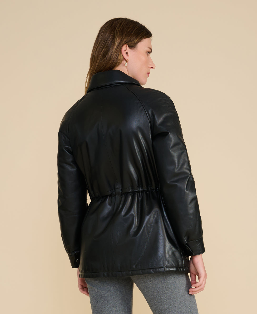 Rear view of the Sheridan black leather utility jacket with tailored utility silhouette