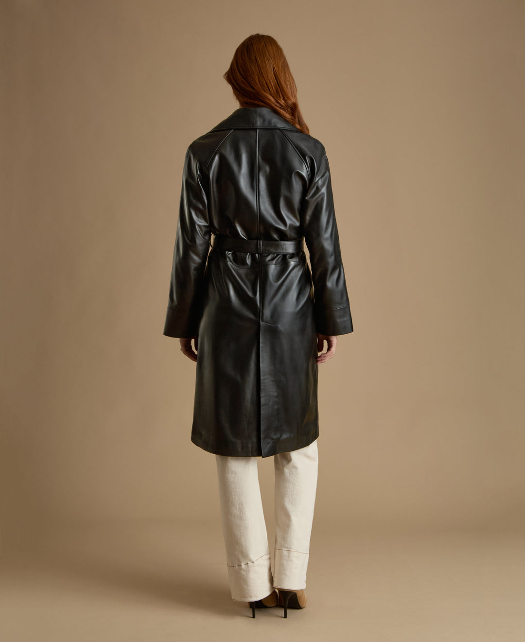 Back view Sloane black leather trench coat belted mid length leather coat
