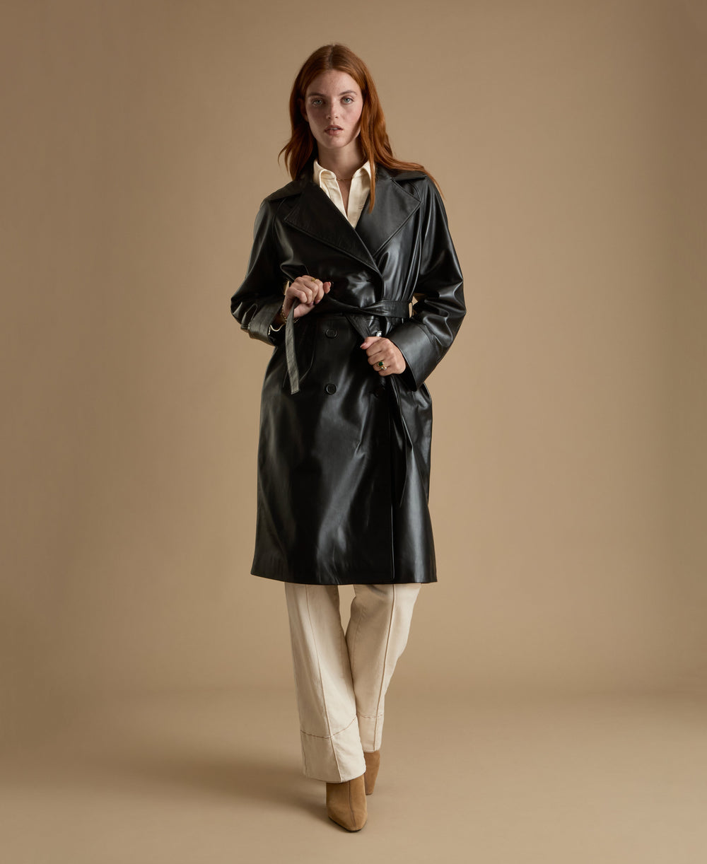 Sloane black leather trench coat full length belted leather coat walking view