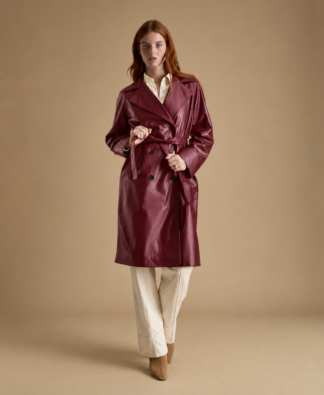 Sloane women's light burgundy leather trench coat styled with belted waist