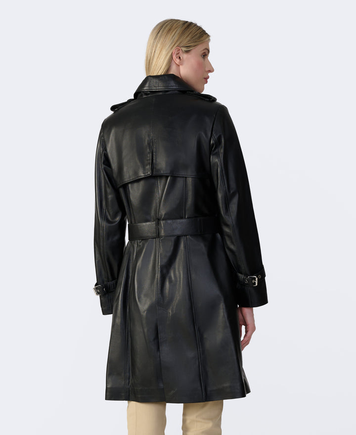 Back view of women’s black leather trench coat with belt and storm flap knee-length design