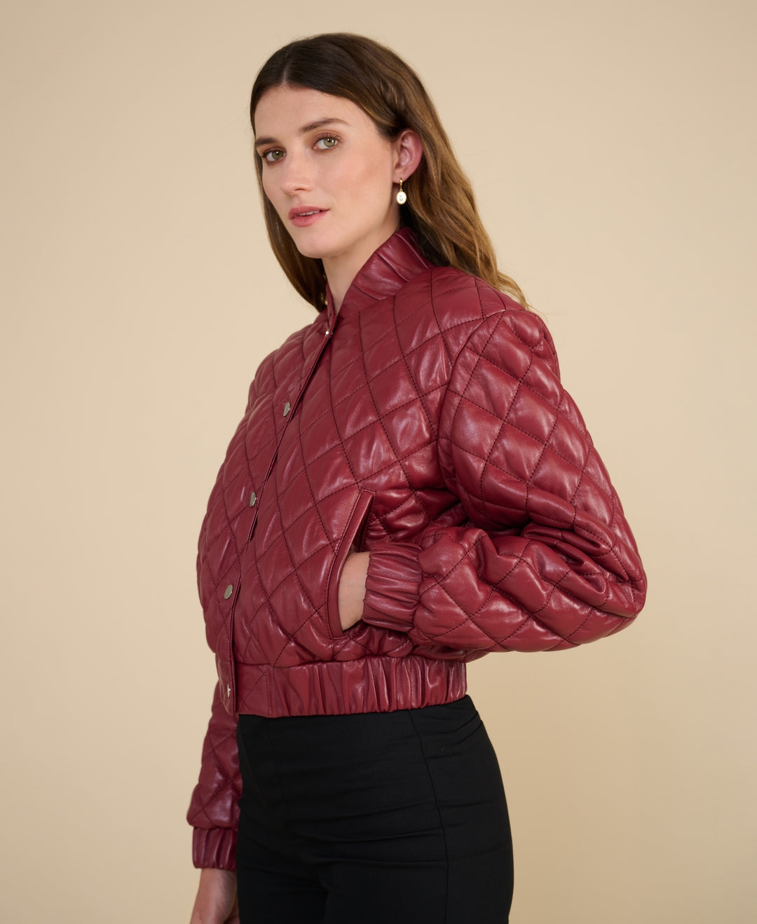 Side profile of Aveline light burgundy quilted leather jacket