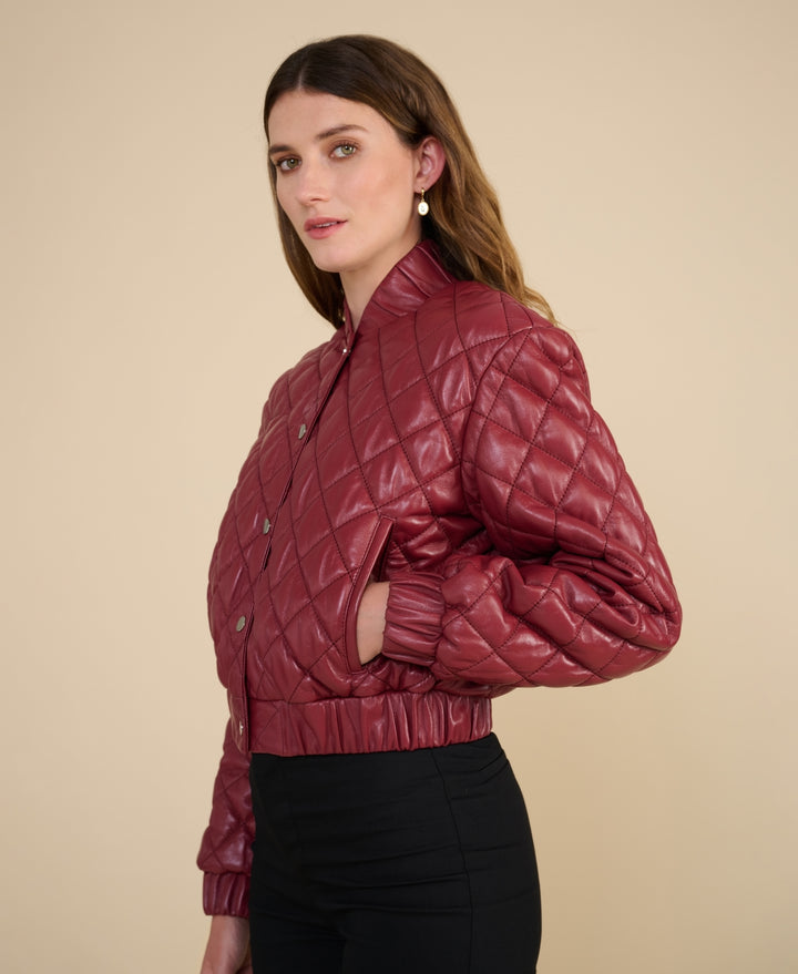 Side profile of Aveline light burgundy quilted leather jacket